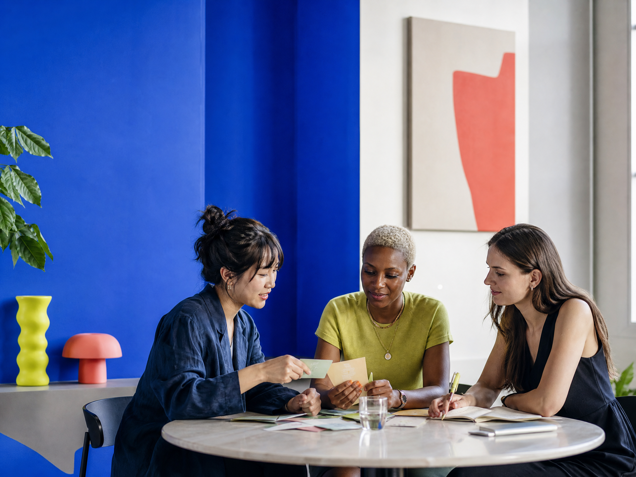 Women founders and builders collaborating around a table